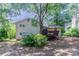 Exterior showcasing a home's backyard with a wooden deck and shed at 6708 Bedford Rd, Rex, GA 30273