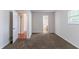 Spacious bedroom featuring carpet and multiple entryways to other parts of the home at 6708 Bedford Rd, Rex, GA 30273