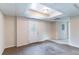 Bedroom featuring neutral walls, brown carpet, exterior door and paneled drop ceiling at 6708 Bedford Rd, Rex, GA 30273