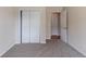Bedroom features plush carpet, a closet, and a door that leads to another room at 6708 Bedford Rd, Rex, GA 30273