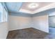 Bedroom featuring neutral walls, brown carpet, and paneled drop ceiling at 6708 Bedford Rd, Rex, GA 30273