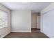 Comfortable bedroom with neutral carpet, a window, and a closet with sliding doors at 6708 Bedford Rd, Rex, GA 30273