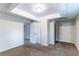 Bedroom featuring neutral walls, brown carpet, closet, and paneled drop ceiling at 6708 Bedford Rd, Rex, GA 30273