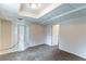 Bedroom featuring neutral walls, brown carpet, and paneled drop ceiling at 6708 Bedford Rd, Rex, GA 30273