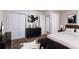 Spacious main bedroom featuring minimalist decor, a large closet, and plush carpeting at 6708 Bedford Rd, Rex, GA 30273