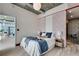 Stylish bedroom with unique wallpaper, a comfortable bed, and a view of the living area at 943 Peachtree Ne St # 814, Atlanta, GA 30309