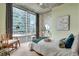 Cozy bedroom with large windows, modern decor, and natural light at 943 Peachtree Ne St # 814, Atlanta, GA 30309