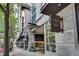 Modern condo building entrance with street-level retail and attractive architectural details at 943 Peachtree Ne St # 814, Atlanta, GA 30309