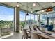 Open-concept living and dining area with industrial-chic design and city skyline views at 943 Peachtree Ne St # 814, Atlanta, GA 30309