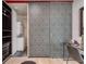 Dressing room with patterned sliding doors, a closet, and a washer/dryer at 943 Peachtree Ne St # 814, Atlanta, GA 30309