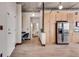 Hallway shot showcasing an entryway, a nook and a partial view of the kitchen with stainless steel appliances at 943 Peachtree Ne St # 814, Atlanta, GA 30309
