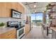 Modern kitchen featuring stainless steel appliances, bright lighting, and open floor plan at 943 Peachtree Ne St # 814, Atlanta, GA 30309