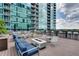 Outdoor lounge with a fire pit, seating and high rise views at 943 Peachtree Ne St # 814, Atlanta, GA 30309