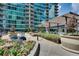 Beautiful outdoor terrace with vibrant flowers, seating, and high rise views at 943 Peachtree Ne St # 814, Atlanta, GA 30309