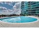 Stunning outdoor pool with lounge chairs and a backdrop of a modern high rise at 943 Peachtree Ne St # 814, Atlanta, GA 30309
