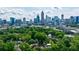 Scenic aerial shot featuring a residential area with mature trees and the Atlanta skyline in the distance at 1190 Francis Nw St, Atlanta, GA 30318