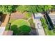 Aerial view of landscaped backyard with lawn, patio, shed, planting beds and privacy fence at 1190 Francis Nw St, Atlanta, GA 30318