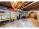 Unfinished basement with exposed ducts, wooden ceiling, shelving, and ample storage space at 1190 Francis Nw St, Atlanta, GA 30318