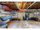 Spacious unfinished basement with shelves, ample storage, exposed ductwork, and concrete flooring at 1190 Francis Nw St, Atlanta, GA 30318