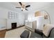 Bedroom featuring a crib, fireplace, cozy chair, and soft, inviting decor at 1190 Francis Nw St, Atlanta, GA 30318