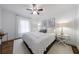 Bright bedroom with white bedding, side tables, hardwood floors, and ample natural light at 1190 Francis Nw St, Atlanta, GA 30318