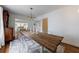 Dining room with a rustic wooden table and modern transparent chairs at 1190 Francis Nw St, Atlanta, GA 30318