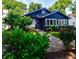 Charming blue home featuring a stone walkway, well-maintained landscaping, and inviting curb appeal at 1190 Francis Nw St, Atlanta, GA 30318