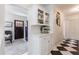 Hallway features a coffee station with an espresso machine and black and white marble flooring at 1190 Francis Nw St, Atlanta, GA 30318