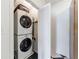 Compact laundry closet with stacked washer and dryer units at 1190 Francis Nw St, Atlanta, GA 30318