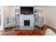 Cozy living room featuring a fireplace, built-in shelves, and comfortable seating, perfect for relaxing at 1190 Francis Nw St, Atlanta, GA 30318