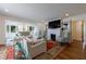 Bright living room featuring a fireplace, built-in bookshelves, and large windows at 1190 Francis Nw St, Atlanta, GA 30318