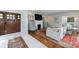 Open living room with fireplace, hardwood floors, and comfortable seating, perfect for relaxing and entertaining at 1190 Francis Nw St, Atlanta, GA 30318