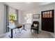 Home office with natural light featuring a wooden desk, neutral walls and carpet, and a private entrance at 1190 Francis Nw St, Atlanta, GA 30318