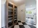 Hallway pantry with glass doors and views into the modern kitchen at 1190 Francis Nw St, Atlanta, GA 30318