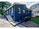 A charming home exterior with painted brick and a cozy outdoor area, perfect for grilling and gatherings at 1190 Francis Nw St, Atlanta, GA 30318