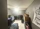 Unfinished basement featuring tiled floors, a ceiling fan, and ample storage at 148 Parkside Dr, Stockbridge, GA 30281