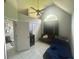 Bedroom featuring a ceiling fan, large window, and access to closet and bathroom at 148 Parkside Dr, Stockbridge, GA 30281