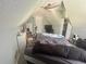 This bedroom features a ceiling fan, closet space, and unique ceiling design at 148 Parkside Dr, Stockbridge, GA 30281