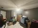 The bonus room has neutral gray walls, a ceiling fan, and lots of storage at 148 Parkside Dr, Stockbridge, GA 30281