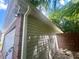 Exterior shot of the house with white vinyl siding and a brick foundation at 148 Parkside Dr, Stockbridge, GA 30281