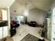 Living room with tile flooring, high ceilings, and natural light from the doors at 148 Parkside Dr, Stockbridge, GA 30281