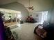 A bright living room with tile floors, a ceiling fan, and multiple entryways at 148 Parkside Dr, Stockbridge, GA 30281