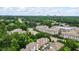 Aerial view shows the property nestled among lush trees and foliage, close to city amenities at 200 Mystic Ct, Atlanta, GA 30342