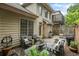 Backyard featuring a patio with comfortable seating, lush greenery, and a grill at 200 Mystic Ct, Atlanta, GA 30342