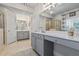 Bright bathroom features a long vanity, a separate shower, and two sinks with grey cabinets at 200 Mystic Ct, Atlanta, GA 30342