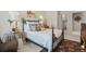 Bedroom features a metal bed frame, a side table, and a patterned area rug at 200 Mystic Ct, Atlanta, GA 30342