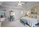Airy bedroom with a tray ceiling, light blue furniture accents, and neutral carpet at 200 Mystic Ct, Atlanta, GA 30342