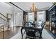 Formal dining room with dark walls, chandelier, and hardwood floors, located adjacent to front entryway at 200 Mystic Ct, Atlanta, GA 30342