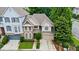 Charming two-story home with brick and siding exterior, two-car garage, and well-kept front lawn at 200 Mystic Ct, Atlanta, GA 30342