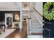 Elegant foyer featuring hardwood floors, staircase, and a view into the living spaces at 200 Mystic Ct, Atlanta, GA 30342